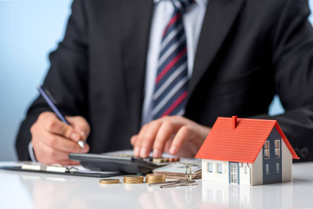 Businessman signs the contract. Purchase agreement for new house.  Home ownership concept.